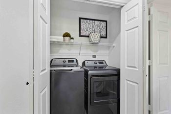 a small laundry room with a washer and dryer